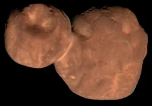 In 2019, New Horizons made a close flyby of the Kuiper Belt object Arrokoth—seen here in enhanced color. Its distinctive two flattened lobes likely formed from the gentle merger of two ancient bodies, offering clues to planetary formation. Credit: NASA, JHU APL, SwRI, Roman Tkachenko
